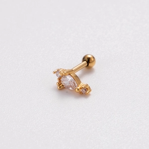 Macro detail of gold-plated butterfly screw back earring with sparkling zircon stones