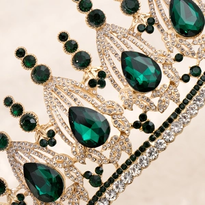 Luxurious vintage baroque bridal crown with green gems and crystals in gold metal