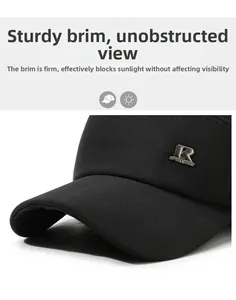 Close-up of winter baseball cap brim featuring a metal R emblem and durable fabric
