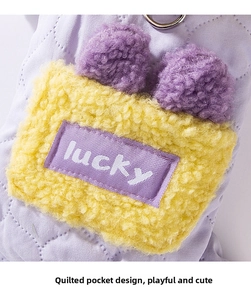 Detail of dog quilted cotton coat featuring yellow fleece pocket and lucky badge