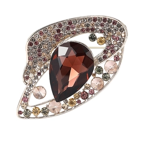 Macro shot of rose gold vintage brooch with colorful rhinestones and pear-cut crystal