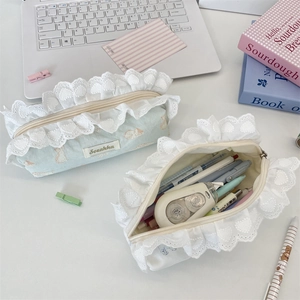 Detailed view of lace trim cat pencil case with large capacity and floral embroidery detail