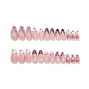 French long almond press-on nails with bow and heart designs for Valentine's Day