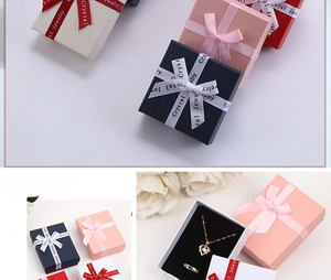 Detail of luxury jewelry gift boxes with satin ribbons and black sponge inserts