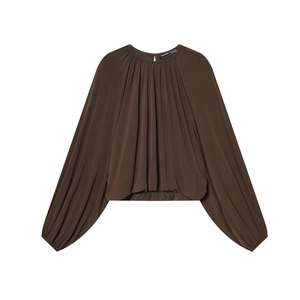 Women's dark brown loose crewneck blouse with pleated hem and lantern sleeves