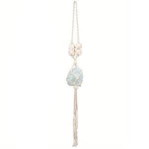 Detail of bohemian hand-woven cotton macrame net with mint green crystal and wooden bead