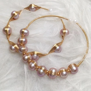 Handmade 14K gold wire wrapped hoop earrings with pink freshwater pearls on white fur