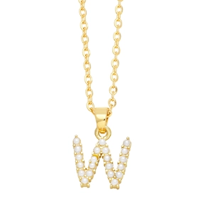 Close-up of golden letter W necklace pendant featuring white faux pearls on an O-chain