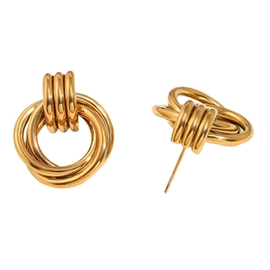Detailed view of gold multi-layer coiled hoop earrings with glossy metallic finish