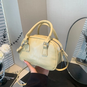 Vintage style cream yellow pleated leather handbag with adjustable crossbody strap