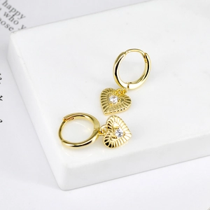 Elegant gold heart earrings with sunburst texture and sparkling zircon inlay