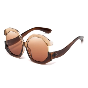 Oversized cat-eye sunglasses with translucent tea frames and gradient lenses for women