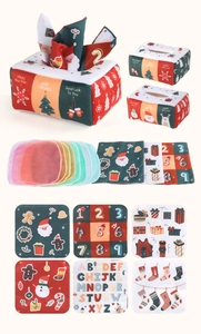 Detail view of a Christmas cloth tissue box toy with educational number and alphabet squares