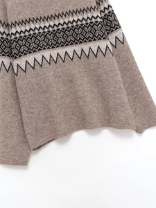 Close-up of Fair Isle geometric jacquard pattern on a camel knitted sweater hem