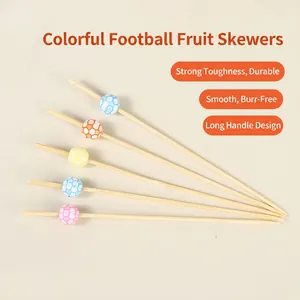 Bamboo fruit picks with colorful soccer ball decorations for parties and cocktails
