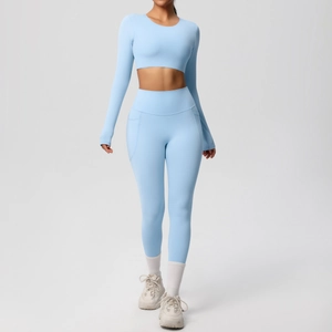 Light blue high-waist yoga set with long sleeve crop top and side pocket leggings