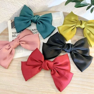 Set of five large satin bow hair clips in green, pink, yellow, black and red colors