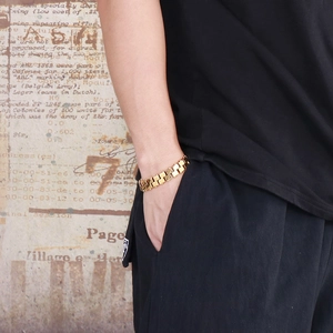 Men's geometric gold titanium steel bracelet with watchband style links on wrist