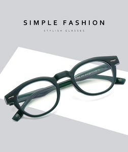 Detail view of dark green acetate sunglasses with metal hinges and N3669 model engraving