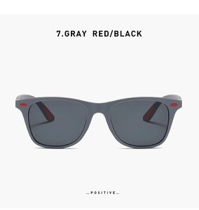 Front view of matte gray square frame sports sunglasses with red details and black lenses
