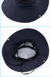Detail of navy sun hat featuring breathable mesh lining and adjustable windproof chin strap