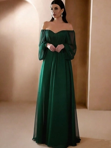 Detailed pleated bodice and elegant off-shoulder neckline on a dark green chiffon evening gown