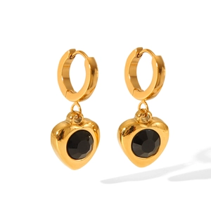 Detail of 18K gold-plated heart earrings featuring a centered black zircon gemstone