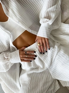 White textured vertical stripe shirt and shorts set with a matching tank top for women