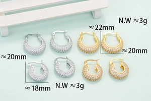 Golden and silver hoop earrings with full zircon stones in different sizes and weights