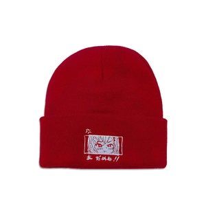 Detailed view of red knitted beanie featuring high-quality anime girl character embroidery