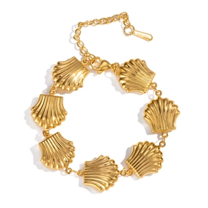 Detail of gold shell link bracelet in stainless steel with lobster clasp and extender