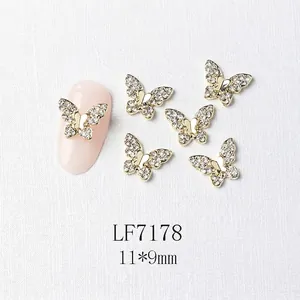 Macro shot of 11x9mm butterfly nail art charms with gold metal and zircon inlay