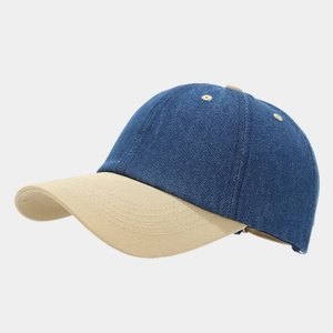 Detailed side view of two-tone denim baseball cap in navy blue and khaki color