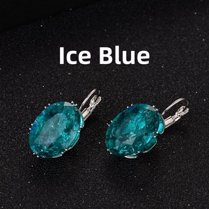 Detail of leverback earrings featuring oval ice flower dark teal faceted gemstones