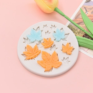 Round white silicone mold with maple leaf designs for fondant, chocolate and cake decoration
