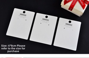 Detailed view of 6x8cm white matte jewelry cards for silver earrings and necklaces