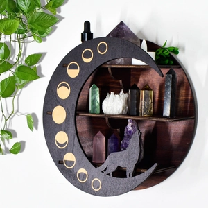 Detailed view of bohemian moon-phase wooden shelf with multi-layer storage and wolf silhouette