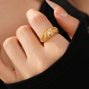 Detailed macro view of 24k gold plated lattice ring with sparkling zircon inlays