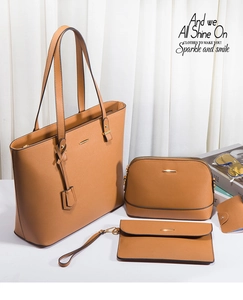 Detail of a 4-piece brown faux leather handbag set with elegant gold metal trim accents