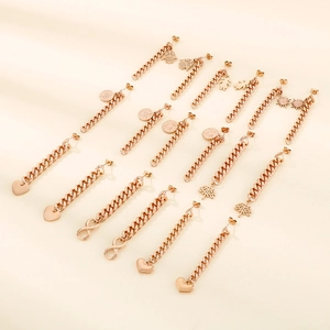 Rose gold Cuban link chain drop earrings with assorted geometric symbol pendants