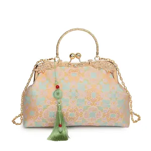 Elegant vintage beige brocade floral evening handbag with gold handle and green tassel