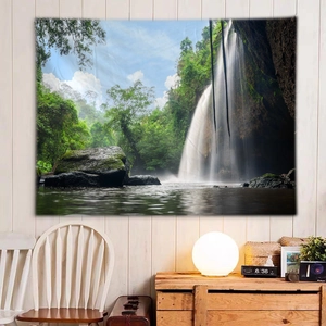 Macro view of waterfall forest tapestry hanging on a wooden wall in a cozy room decor