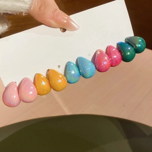 Detailed view of ten colorful acrylic teardrop earrings in vibrant gradient rainbow colors