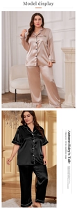 Detail view of satin silk pajamas with contrast piping in champagne and black colors