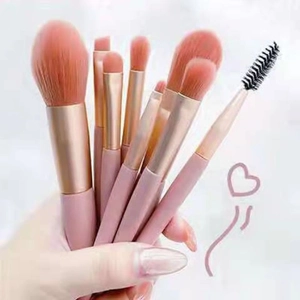 Portable 8-piece pink makeup brush set with soft bristles and golden metal ferrule