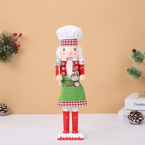 Detail of chef nutcracker wooden doll with white hat and spoon for Christmas decor