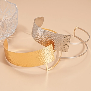 Modern gold and silver hammered metal open collar necklace with geometric hollow lines