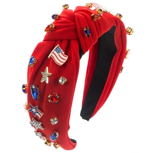 Detail of red knotted headband with US flag enamel, crystal stones and silver stars