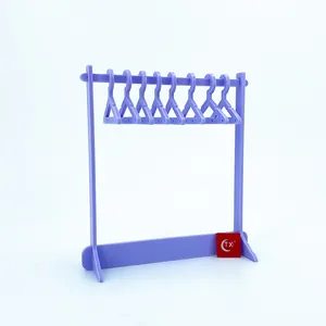 Detail of creative purple acrylic mini clothes hanger stand for earrings and necklaces