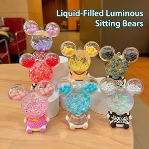 Luminous sitting bear keychain charms with liquid sand and starry acrylic details